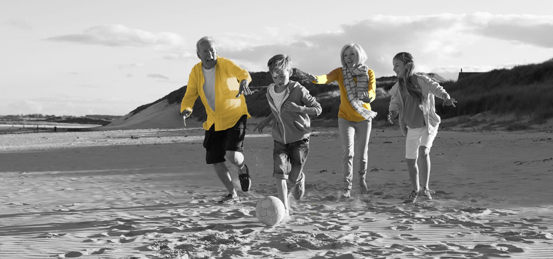  healthy family running the beach promoting physiotherapy clinic