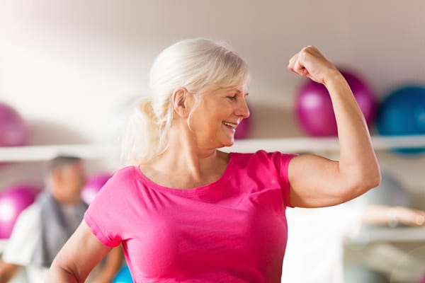 senior woman flexing muscle