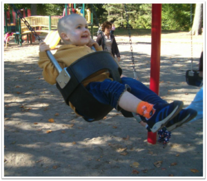 child on swing set